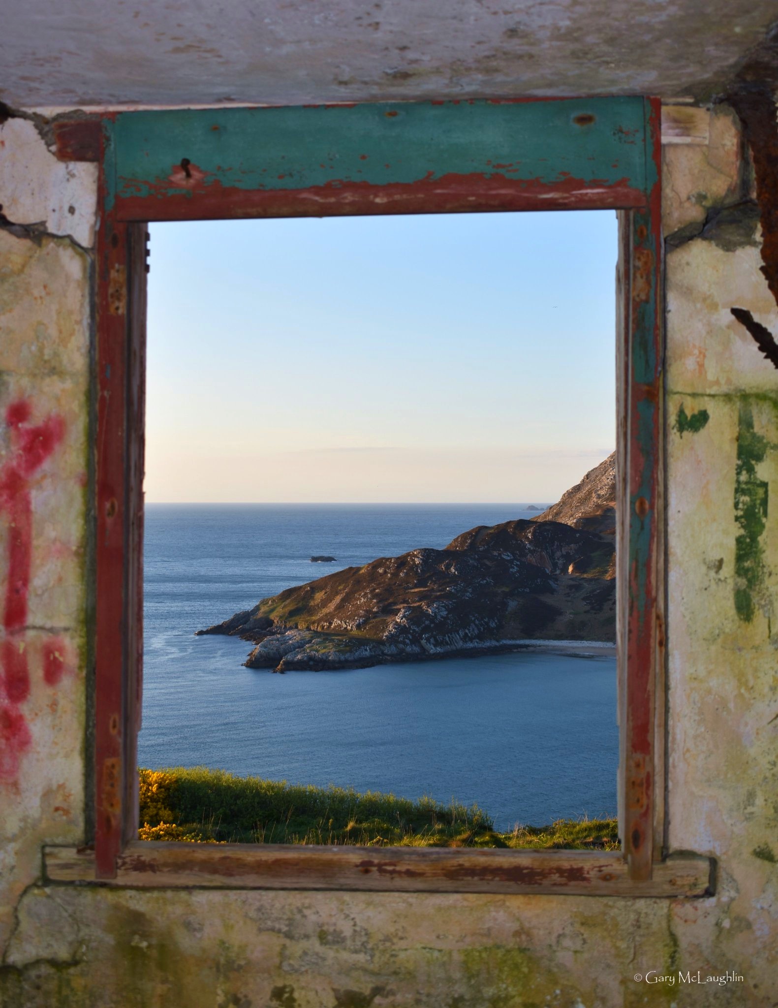 Dunree Bay framed by an old window opening